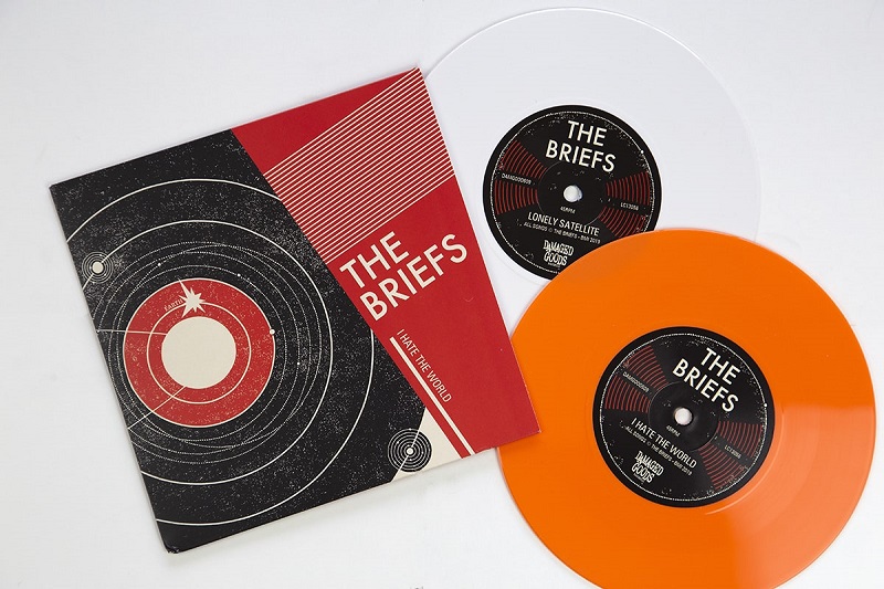 The Briefs "I Hate the World" white and orange coloured vinyl. Manufactured by Key Production.