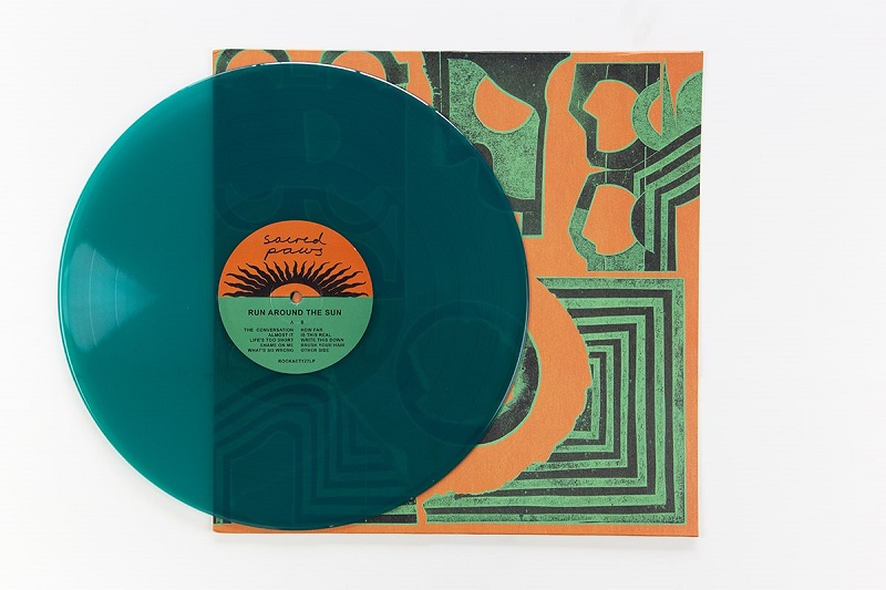 Sacred Paws "Run Around The Sun" teal coloured vinyl. Manufactured by Key Production.